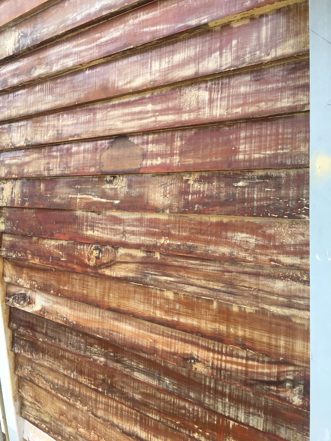 Before close-up stripped weatherboards