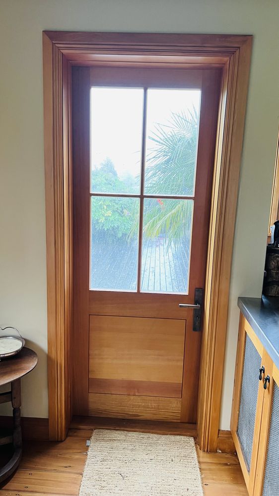 Heritage sash windows mid-strip showing raw timber